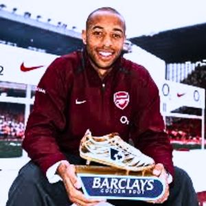 Thierry Henry celebrating Arsenal's Premier League Golden Boot win wearing the red and white Arsenal long sleeve jacket jersey